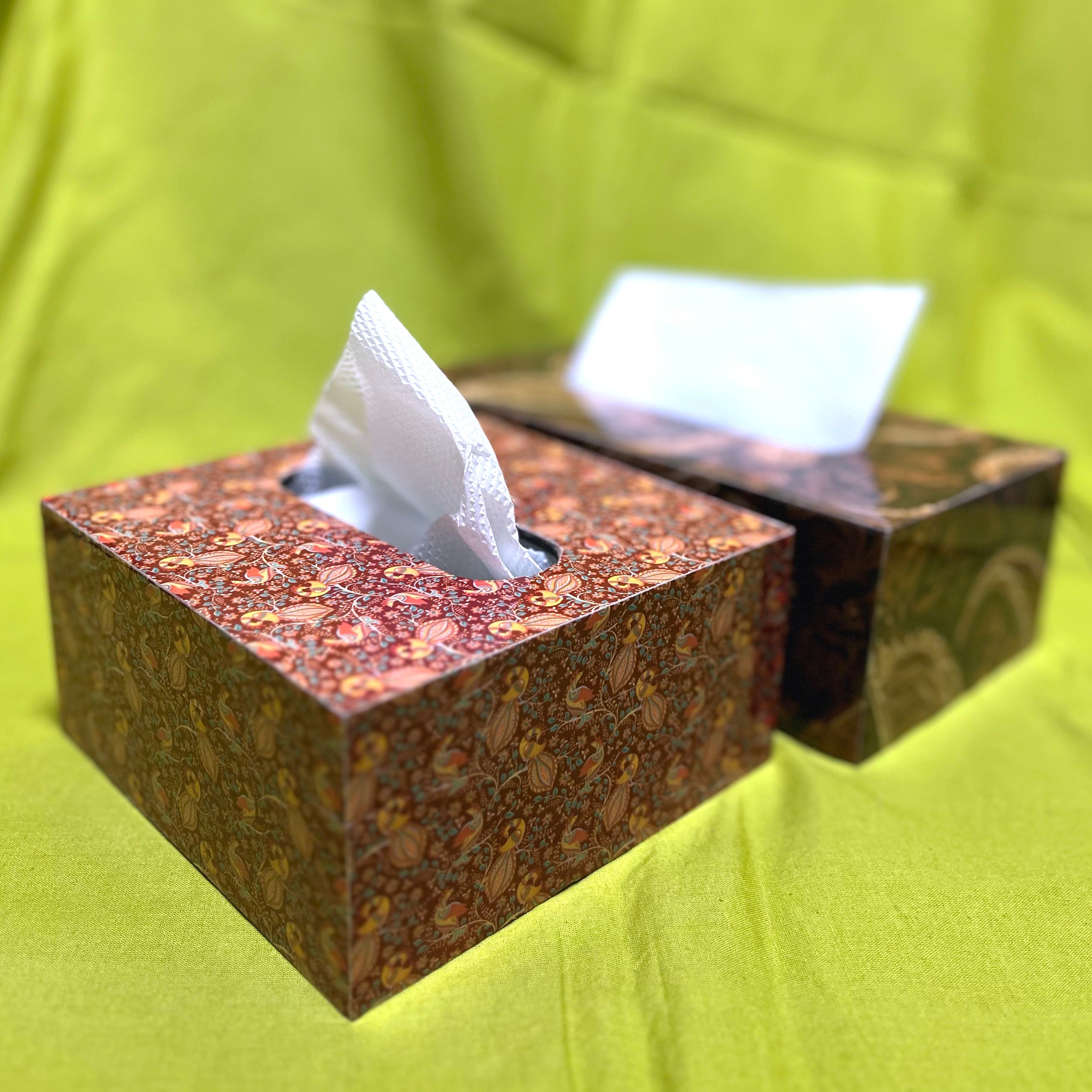 A picture of a square and rectangle tissue box with intricate pattern designs