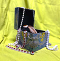 A picture of an open box with jewellery inside
